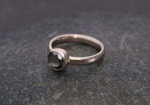 black diamond solitaire ring in white gold