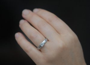 diamond-4mm-princess-cut-in-4mm-wide-platinum-band-on-hand-2