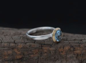 aquamarine-8mm-18K-gold-halo-and-silver-band-