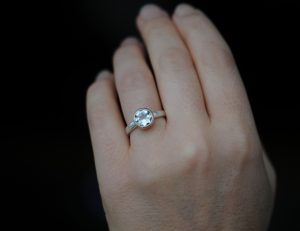 green amethyst in 9K rose gold ring with silver band on hand