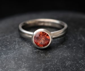 sunstone bezel set ring in 18K white gold