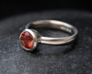 sunstone bezel set ring in 18K white gold
