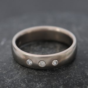 18K white gold wedding band with 3 diamonds