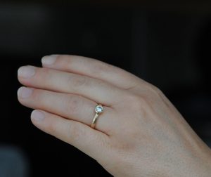 diamond-set-in-18K-rose-gold-ring-on-hand2