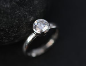 moissanite 6mm round bezel set in platinum