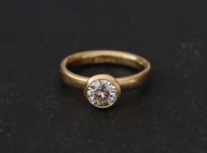 1.25ct moissanite halo ring in 18K y gold
