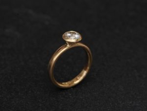 1.25ct moissanite halo ring in 18K y gold