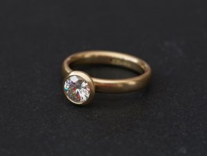 1.25ct moissanite halo ring in 18K y gold