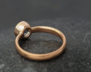 aquamarine AAAA 7mm bezel set in 18K r gold
