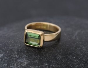 green tourmaline ring set in satin finished 18k yellow gold.