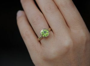 peridot 8mm halo ring in 18K y gold