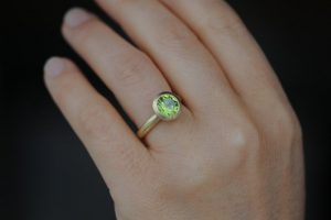 peridot 8mm halo ring in 18K y gold
