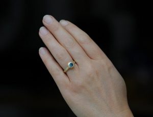 blue topaz medieval ring in gold on hand