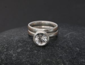 white topaz 8mm halo wedding set in silver