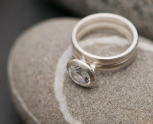 white topaz 8mm halo wedding set in silver