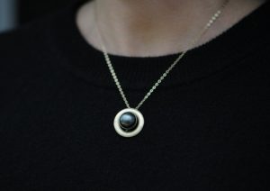 black pearl halo necklace in 9k gold