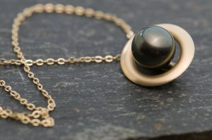 black pearl halo necklace in 9k gold
