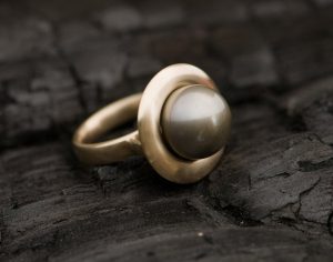 black tahitian pearl halo ring in 18K yellow gold