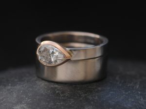 moissanite pear cut wedding set in mixed metal