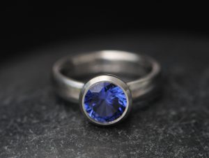 lab created 9mm blue sapphire in bezel set platinum