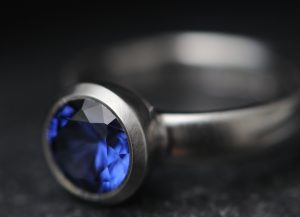 lab created 9mm blue sapphire in bezel set platinum