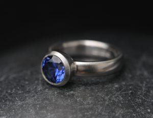 lab created 9mm blue sapphire in bezel set platinum