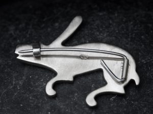 silver rabbit brooch with rubies and sapphire