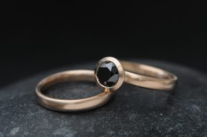 black diamond halo wedding set in 18K rose gold