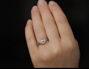 moissanite pear cut ring in mixed metals