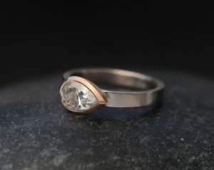 moissanite pear cut ring in mixed metals