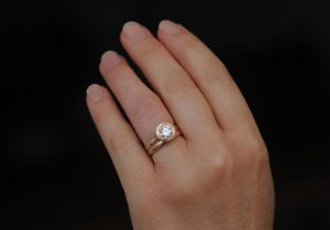 moissanite jamie wedding set in 18K rose gold on hand