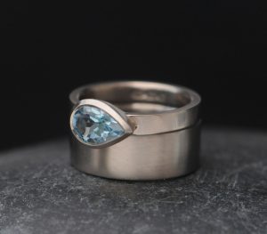 sky-blue-topaz-pear-cut-wide-band-wedding-18K-White-gold