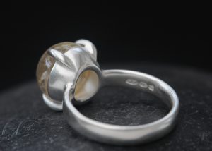 rutilated quartz 12mm cab dragons eye ring silver reverse