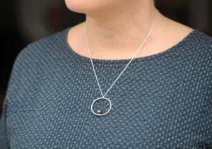 black-pearl-hoop-necklace-in-silver-on-model