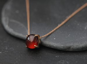 Beautiful hessonite garnet necklace set in 18k Gold. Hessonite garnet is 10mm across. The pendant is 10mm wide and approx 8mm deep. The 18K gold chain can be 16" or 18"please select the length you prefer when you place your order.