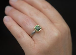green tourmaline 8mm cushion in 18K yellow and white gold