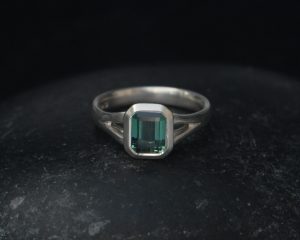 green tourmaline octagon cut split shank ring in silver front