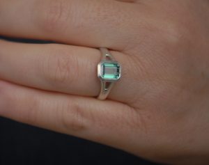 green tourmaline octagon cut split shank ring in silver on hand 2