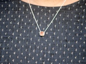 sunstone-8mm-cushion-cut-silver-necklace-on-neck