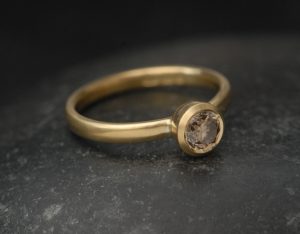 brown-diamond-5mm-bezel-set-ring-in-18K-yellow-gold-left-side-