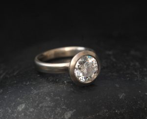 ab-diamond-8mm-halo-ring-in-18K-white-goldside-shot-2