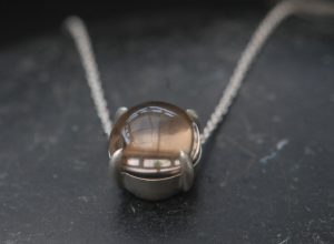 smoky-quartz-10mm-dragons-eye-necklace-in-silver-close-up
