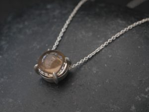 smoky-quartz-10mm-dragons-eye-necklace-in-silver-from-side