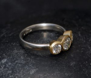 Lab-diamond-3-stone-mixed-metal-ring-18K-and-silver-side-on