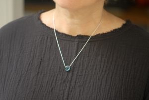 London-blue-topaz-cab-10mm-dragons-eye-necklace-silver-on-neck