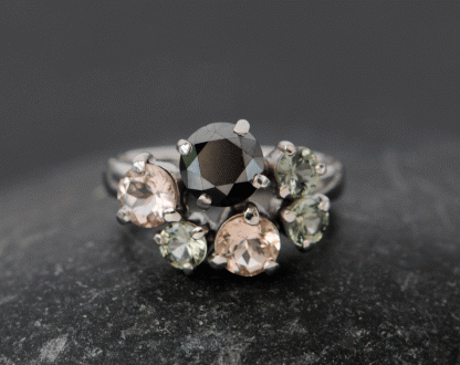 black-diamond-and-sapphire-cluster-ring-in-platinum