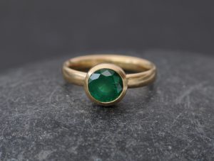 natural emerald set in yellow gold ring