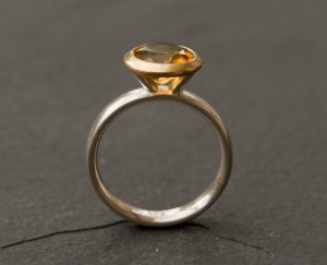 Strong yellow citrine in gold and silver ring. By William White