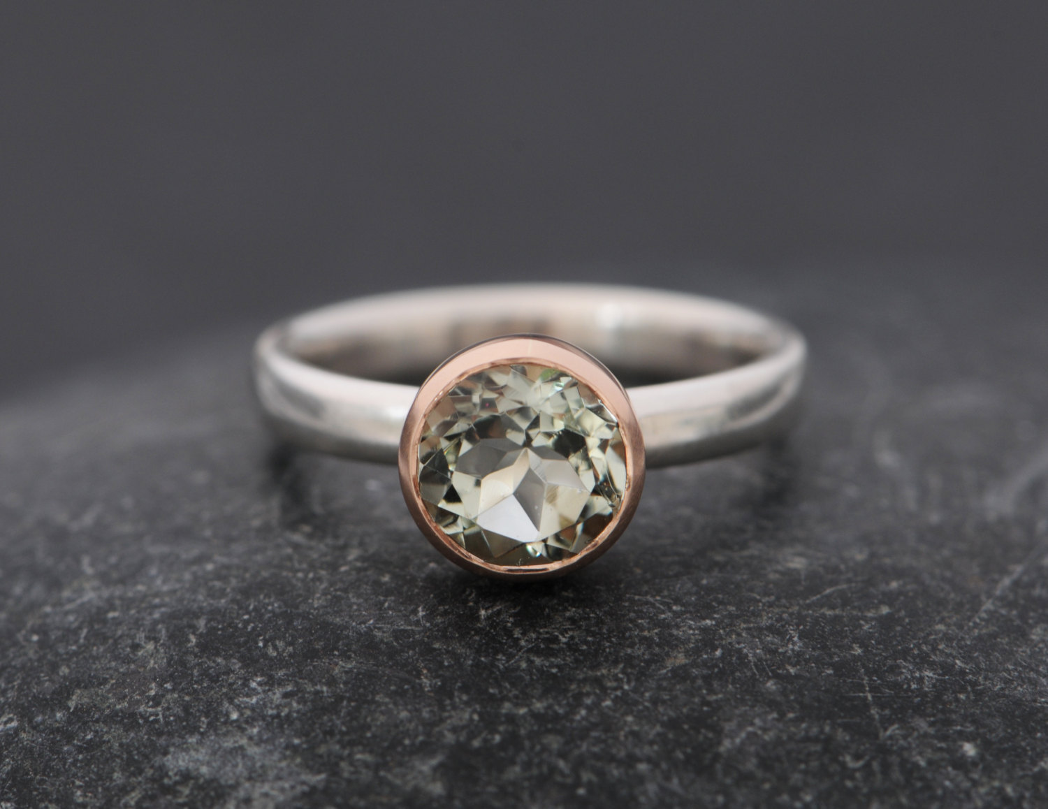 pale green amethyst set in gold bezel on sterling silver ring