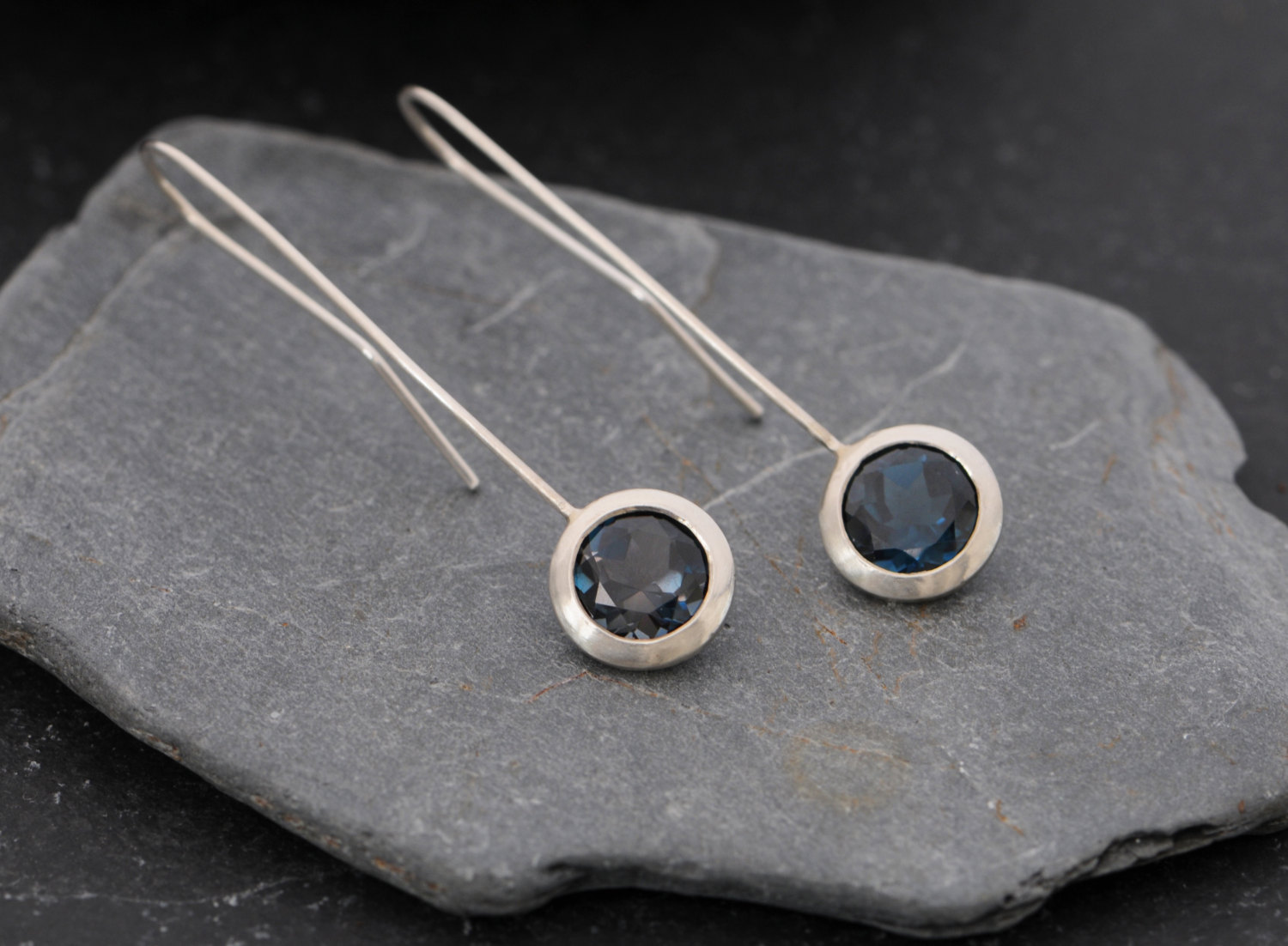 Deep blue, clean and simple London blue topaz 'lollipop' earrings, set in sterling silver. Adjustable length earrings designed and handmade by William White